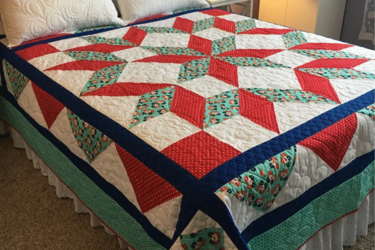 red and green star quilt pattern on a bed